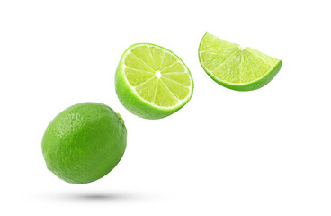 Whole, half and slice fresh lime fruit falling in the air isolated on white background.