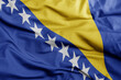waving national flag of bosnia and herzegovina .macro shot. 3D illustration