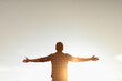 © kieferpix - Young man facing sunset rejoices, laughs, smiles looking up to the sky, enjoys life, happiness.