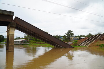 Collapsed bridge in Brazil of highway BR 319 over the Rio Curuca, A bridge pier was not anchored deep enough in the ground during construction and snapped off years later. Near Autazes, Amazonas.