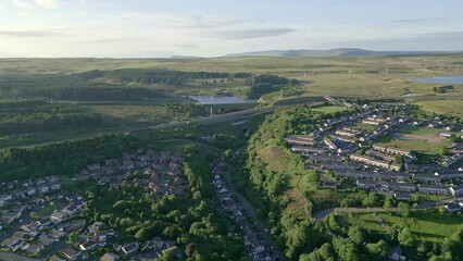 Canvas Print - Aerial view flying low over houses towards a major new road (A465, Ebbw Vale)