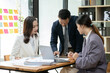 © aekachai - Group of asia business people sitting and talking, meeting, presenting, presenting graphs, chatting happily at the office.