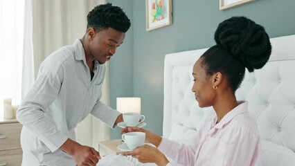 Wall Mural - African couple drink coffee in bed, relax with tea in bedroom and happy in the morning in house. Man and woman with drinks for breakfast in home, energy after sleeping and conversation in apartment