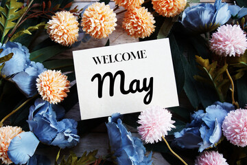 Poster - Welcome May text message with flower decoration on wooden background