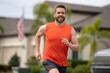 © Volodymyr - Sport runner. Man running. Fit male sport fitness model sprinting outdoors. Attractive man running fast, workout outdoors, runner jogging over american street.