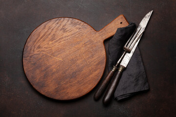 Wall Mural - Empty cutting board, fork and knife