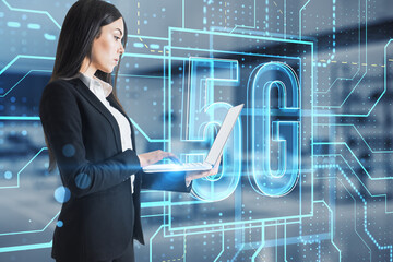 Poster - Attractive young european businesswoman using laptop with glowing linear 5g hologram on blurry office interior background. 5G network and wireless systems. Double exposure.