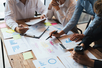 Wall Mural - group of business people brainstorm discussing current finance and economy on company investment paperwork at meeting room