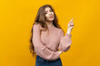 © makedonski2015 - This stunning portrait captures the essence of a young woman with her long hair flowing against a vibrant yellow background. Dressed in a cozy sweater and jeans