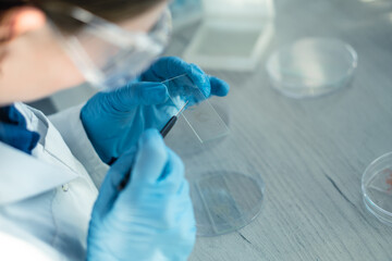 Aufkleber - Medical science laboratory with biotech scientist developing medicine, female biochemist working at computer in pharmaceutics. Research of medical analyzes and experiments. Rear and side view Shot