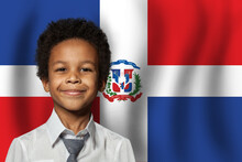Dominican Kid Boy On Flag Of Dominican Republic Background. Education And Childhood Concept