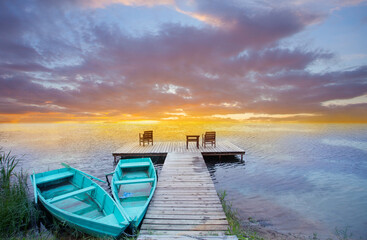 Wall Mural - Boats, jetty and beautiful colourful sunset