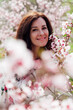© dmitriisimakov - portrait of a woman in pink flowers peach garden trees nature parks walk