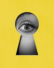 hidden secrets. female eye attentively looking into keyhole against yellow background. contemporary 