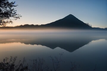 Wall Mural - Tops of snow fells and sky are reflected in clear water of mountain lake, created with generative ai