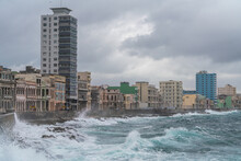 Storm Waves Batter The Seafront Malecon With Its Faded Grandeur Stucco Houses On Malecon, Havana