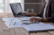© David - Business Asian woman working at office with documents on her desk, calculator to calculate planning analyzing the financial report, business plan investment, finance analysis concept