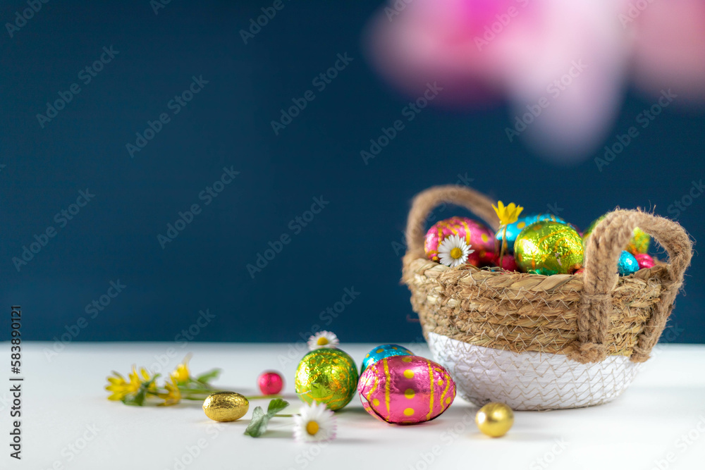 Photo Stock Easter eggs in basket with blue background on white table ...