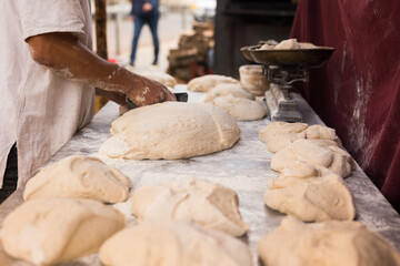 Wall Mural - yeast dough on baking table. cooking process