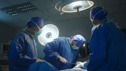 Wall Mural - team professional surgeons and nurses in uniform at work in operating room,performing heart transpla