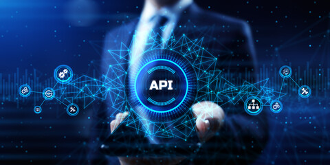 API Application programming interface. Businessman pressing virtual button.