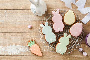 Wall Mural - Easter homemade gingerbread rabbits, carrots, chickens and eggs icing cookies. Festive holiday sweet food concept. Easter baking or decoration idea. White background, holiday concept with copy space