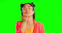 Face, Woman And Blowing Kiss On Green Screen, Background And Studio For Love, Care And Flirting. Portrait Of Happy Asian Model, Air Kissing And Smile Of Romance, Happiness And Emoji On Valentines Day