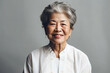 © ADDICTIVE STOCK - Happy elderly woman over white background. Generative AI.