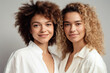 © ADDICTIVE STOCK - Portrait of multiracial women in studio looking at camera over grey background. Generative AI