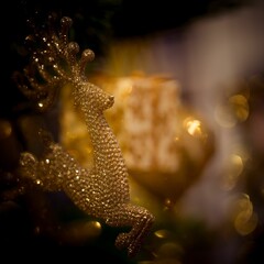 Poster - Beautiful Christmas tree decoration in the shape of golden deer