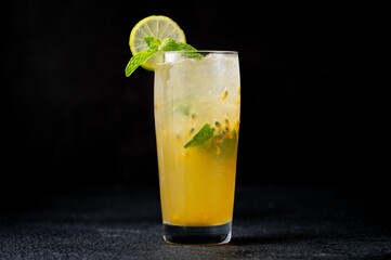 Poster - Refreshing cocktail Mojito in a glass with passion fruit