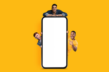 Poster - Great Ad. Three Happy Men Posing Near Blank Smartphone With White Screen