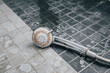 © Trik - Silver shower head with limescales. Shower damaged from water scale.