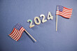 2024 Metallic Numbers with Mini American Flags on Blue Background