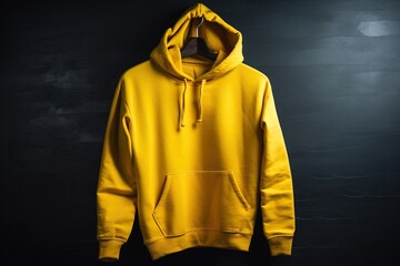  a yellow hoodie hanging on a black wall in a dark room.  generative ai