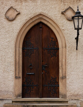 Old Wooden Door In A Church, Antique Door With The Vintage Lamp 