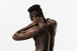 © Rabizo Anatolii - Scoliosis is sideways curvature of the spine of muscular african american man. Rheumatism and arthritis diseases. Rachiocampsis bachache and neck pain of shirtless african man on white background.