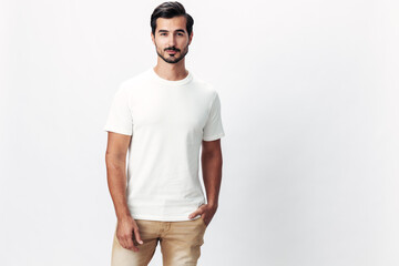 Poster - Male fashion model in a white t-shirt and jeans, smile with teeth joy on a white isolated background, trendy clothing style, copy space, space for text