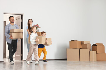 Poster - Happy family with moving boxes entering in new apartment. Settling into home