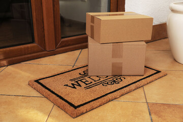 Parcels delivered on mat near front door