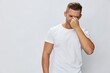 © SHOTPRIME STUDIO - Man runny nose and cough, cold and flu, allergies, pain, in white t-shirt on white isolated background, copy space