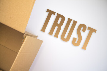 Poster - Trust word with cardboard box. Brown folded card box.