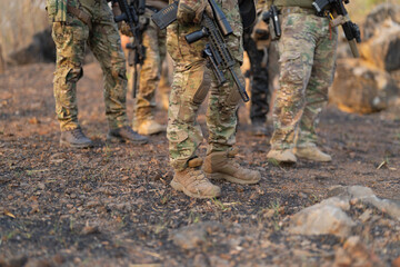 Team of U.S. Army marine corps soldier military war with gun weapon participating and preparing to attack the enemy in Thailand during exercise Cobra Gold training in battle. Combat force.