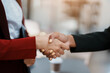 © Jirapong - Multi ethnic business Financial shaking hands, Successful businessmen handshaking after good deal. Business Finishing up meeting contract concept