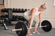 © Phindulo T/peopleimages.com - Fitness, weightlifting and a woman bodybuilder in the gym for a workout to build a strong muscular physique. Exercise, bodybuilding and a female weightlifter training her body in a wellness center