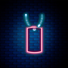 Wall Mural - Glowing neon line Military dog tag icon isolated on brick wall background. Identity tag icon. Army sign. Colorful outline concept. Vector