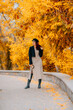 © svetograph - A woman walks outdoors in autumn, enjoys the autumn weather.