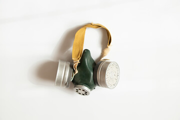 Civilian gas mask with two filters on a white background, an old Soviet filtering means of personal respiratory protection