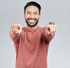 Poster - Pointing, selection and smile with portrait of man in studio for thank you, motivation and amazing. Winner, confident and friendly with male on white background for yes, achievement and satisfaction