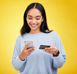 Canvas Print - Woman with smartphone, credit card and ecommerce with smile and online shopping on yellow studio background. Fintech, online payment and bank app with happy female, checkout and internet banking